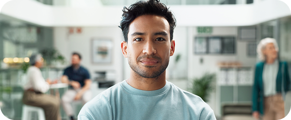 Confident man looking at the camera in a modern office setting